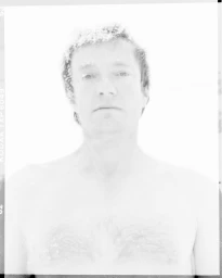 High-key monochrome portrait of a man with textured hair against a bright white background.