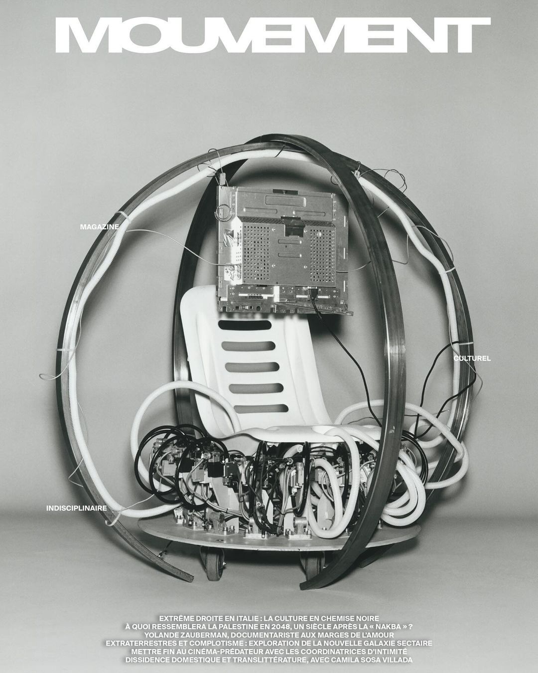 Monochrome image features a wired seat with what appears to be a magazine cover in the background and visible text throughout.