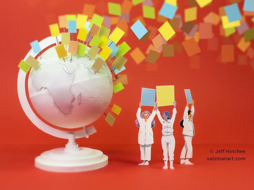 Conceptual image featuring a globe adorned with colorful squares, paper cut-out figures holding signs, set against a vibrant red background.