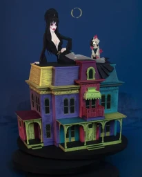 Elvira-style gothic woman and punk dog sitting atop a brightly colored multi-story Victorian dollhouse model against a deep blue background.