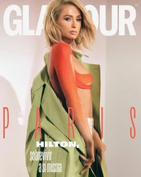 Paris Hilton in a green coat draped over her shoulders on a magazine cover shot by Jeremy Choh