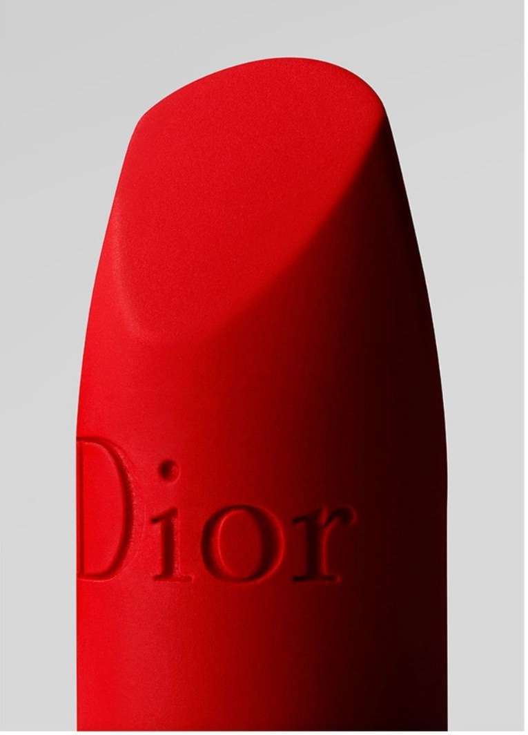 Close-up of a bright red Dior lipstick with the brand name subtly embossed; beauty and fashion photography.
