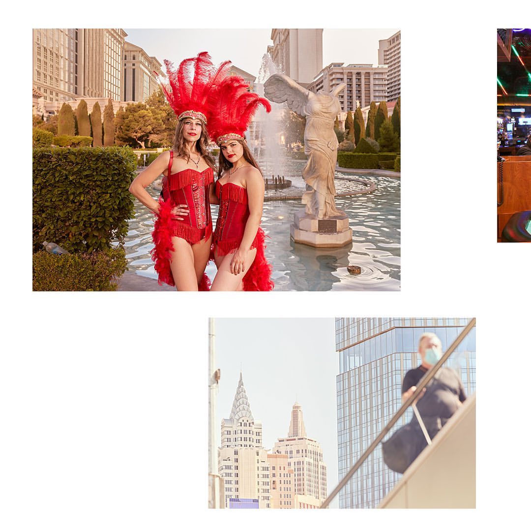 Two showgirls in red feathered costumes pose near a fountain in front of Caesar's Palace, while an anonymous person in a mask walks outdoors.