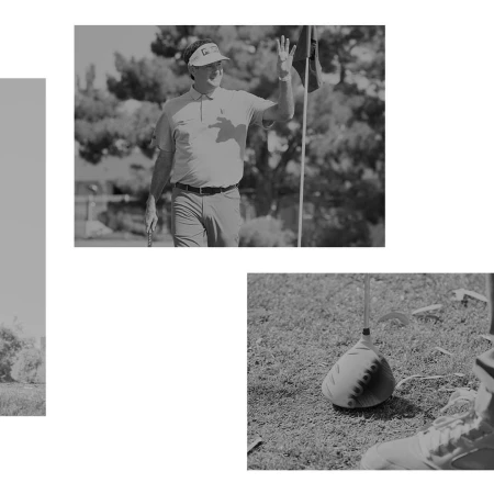 Monochrome shot of a golfer waving near a flag and golf club, with a golf ball and shoe visible on the grass.