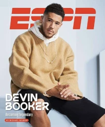 Devin Booker wearing a beige textured sweater and black shorts seated against a minimalist white studio backdrop with ESPN branding.