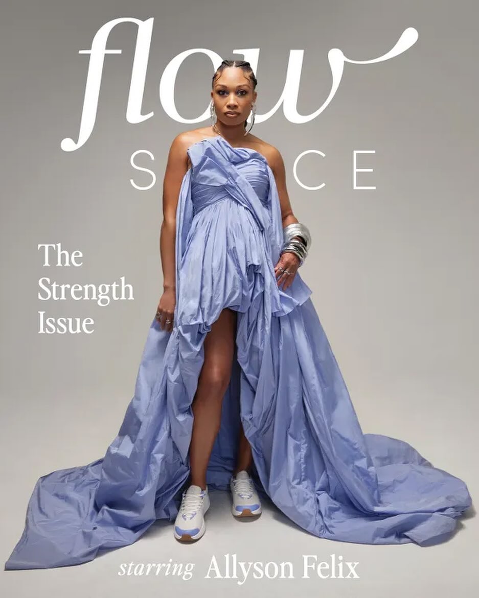 Allyson Felix poses in a light-blue draped gown with sneakers for a magazine cover on a seamless studio background. 