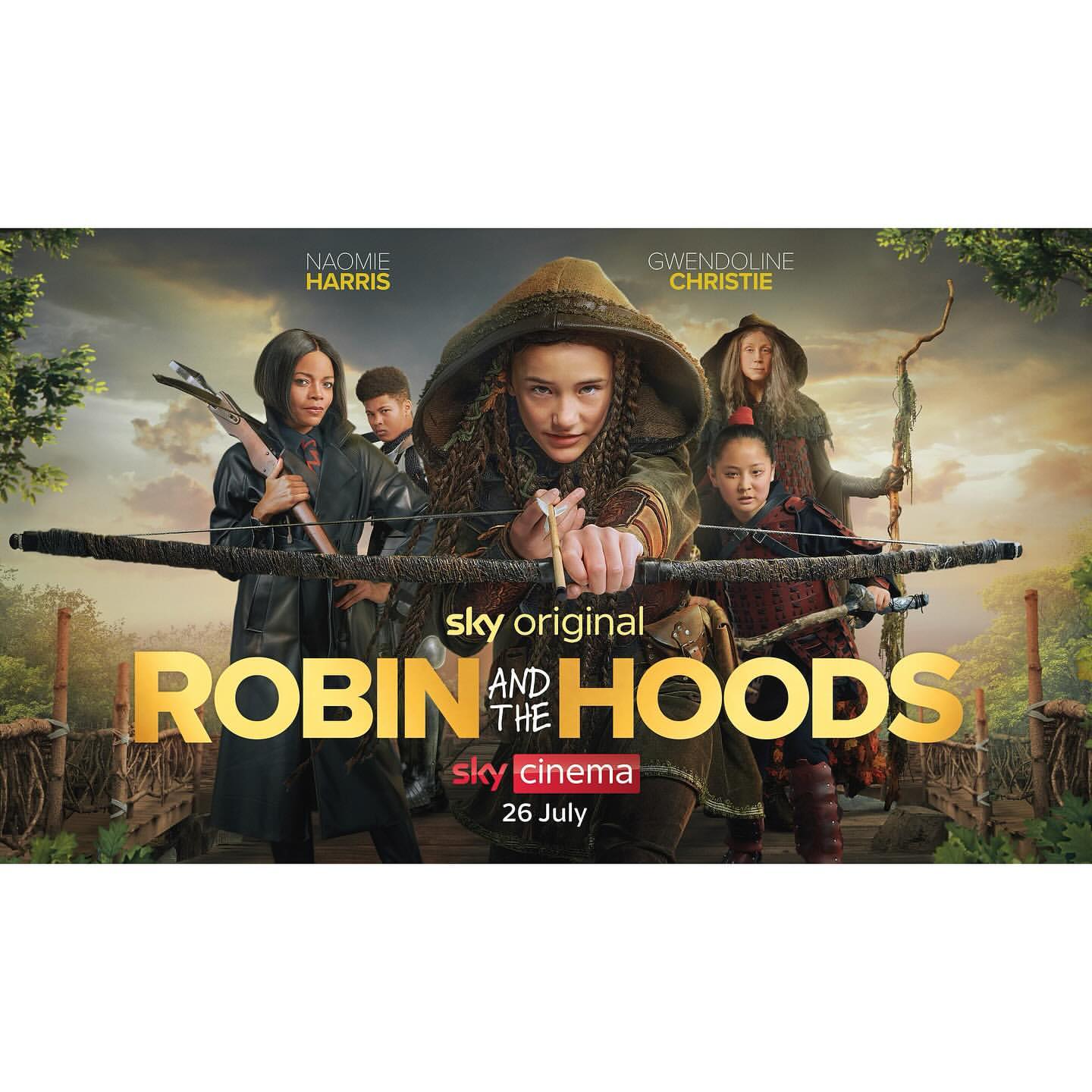 Group of young archers dressed in medieval-style attire in the promotional poster for 'Robin and the Hoods' TV show. 