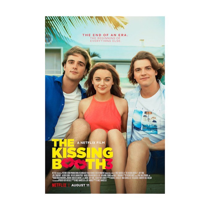 Movie poster for The Kissing Booth 3, featuring three young adults smiling, set against a backdrop of a beach and house. 