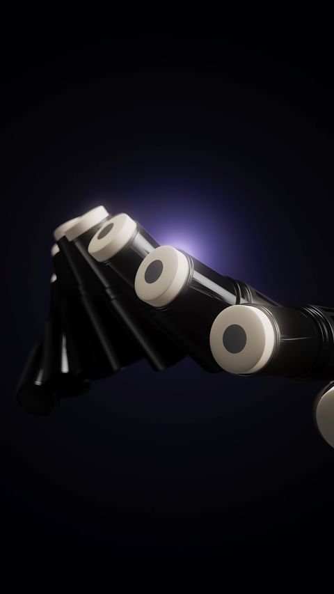 Close-up of black and white bagpipes against a dark background, showcasing the intricate details and design of the musical instrument.