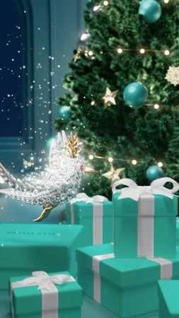 Christmas themed Tiffany & Co. advertisement with a silver bird, blue gift boxes with white bows, and a Christmas tree in the background.