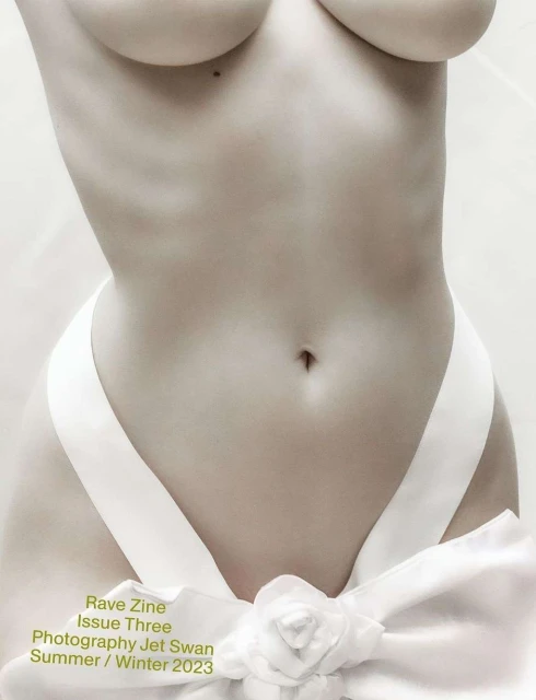 Monochromatic fashion-style torso shot of an adult female partially covered by a white ribbon, featuring soft studio lighting and zine text overlay.
