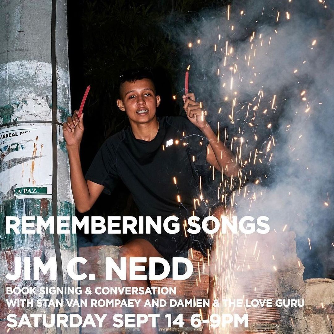 Person with sparklers poses for event poster for Jim C. Nedd's 'Remembering Songs' book signing on Saturday, Sept 14, 6-9PM.