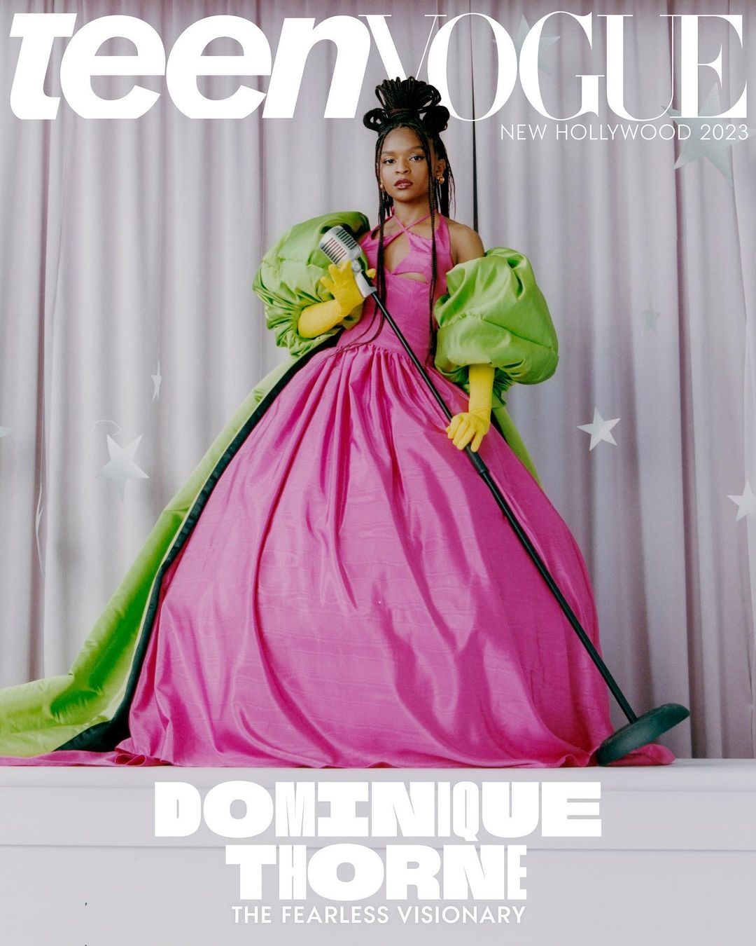 Teen Vogue cover featuring Dominique Thorne in a pink gown with green sleeves, holding a vintage microphone in a photo studio setting.