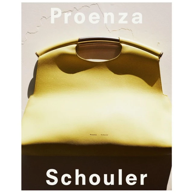 Proenza Schouler leather handbag, light yellow, with a metal handle. Fashion accessory for women, studio lighting, luxury brand product.