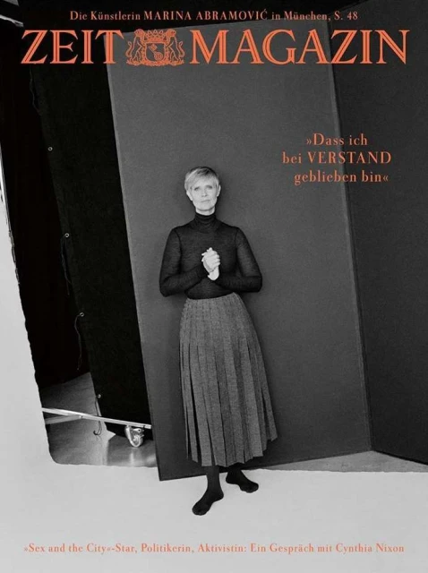 Magazine cover featuring Cynthia Nixon in a gray pleated skirt and black turtleneck, with the magazine's masthead and text overlays.