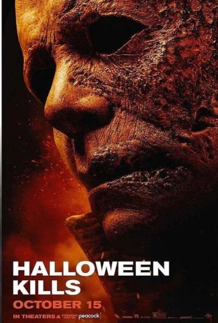 Movie poster for Halloween Kills featuring a textured close-up portrait of Michael Myers's mask with dark orange and black tones.