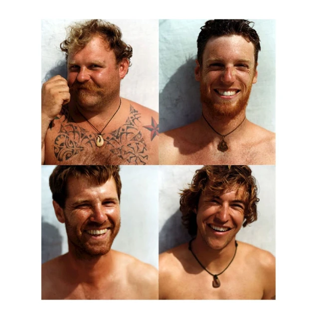 Four men smile for a photo, each wearing necklaces with pendants. They are positioned in a grid layout against a light backdrop.