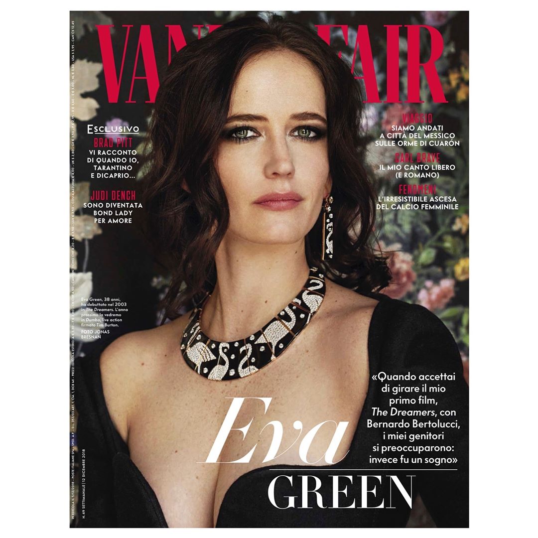 Eva Green on the cover of Vanity Fair Italia, wearing a statement necklace and dress, posing against a floral backdrop.