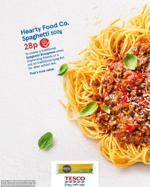 Overhead shot of spaghetti bolognese with basil leaves, promoting Hearty Food Co. spaghetti at 28p. Tesco brand visible.