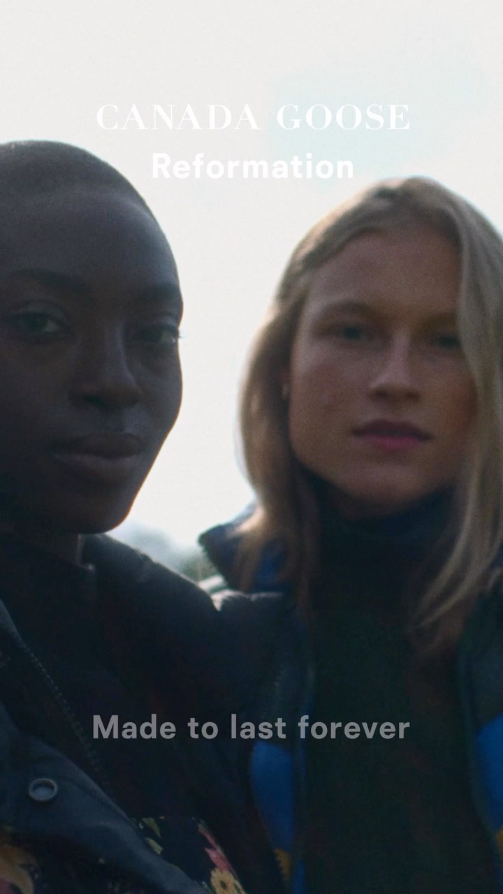 Two women pose for a collaborative campaign with Canada Goose and Reformation, featuring jackets and a sunny outdoor setting.