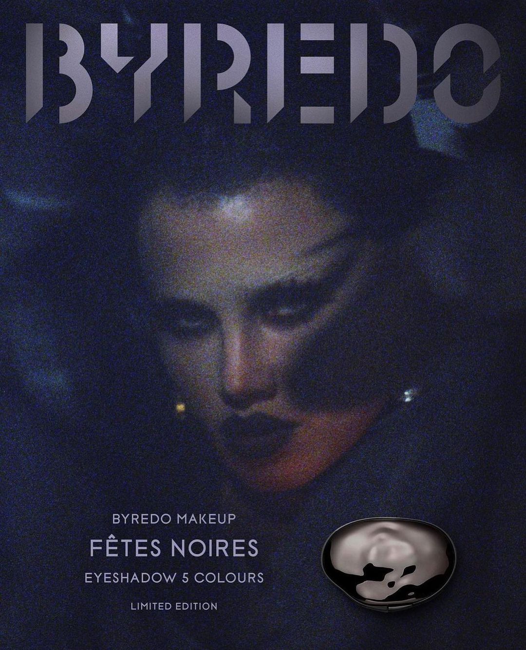 Byredo makeup advertisement featuring a woman with dark eye makeup, showcasing the Fêtes Noires eyeshadow palette against a dark background.