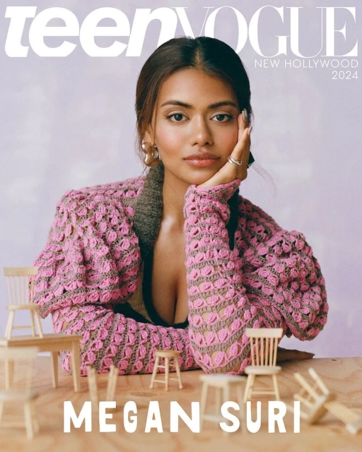 Teen Vogue cover featuring model Megan Suri in a pink crocheted cardigan, seated with miniature wooden chairs, against a soft lilac background.