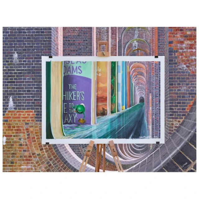 Painting on easel showcases books and architecture with brick arches, vibrant colors, and detailed texture. Decorative indoor setup.