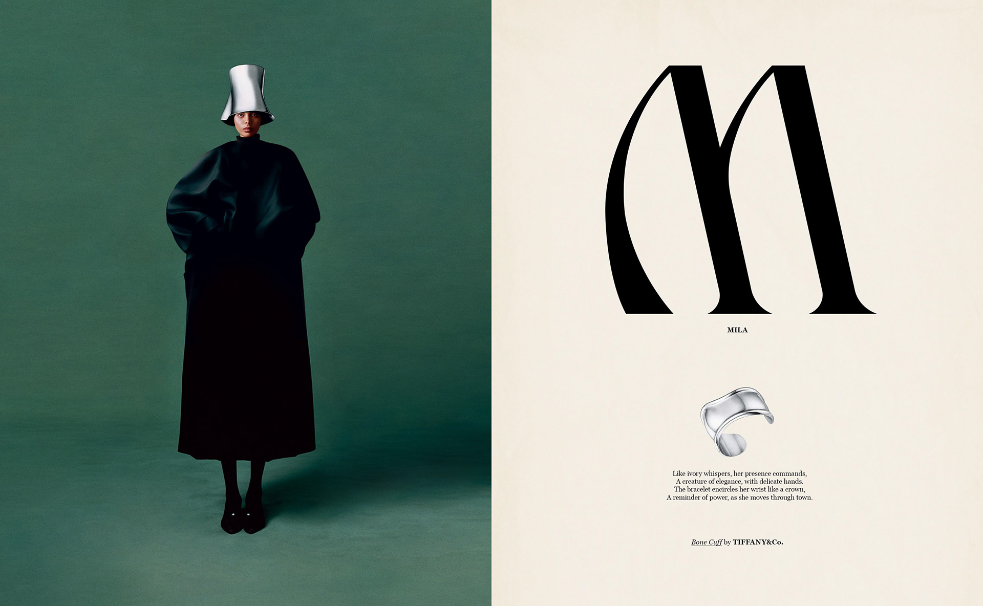 Fashion shot: Woman in long black coat and silver hat stands against dark green backdrop next to graphic typography and jewelry.