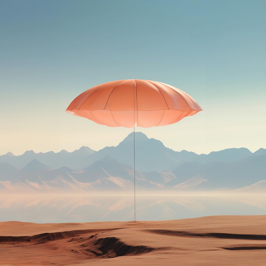 Surreal landscape featuring a single coral-colored umbrella elevated above a desert, mountains, and a clear blue sky.