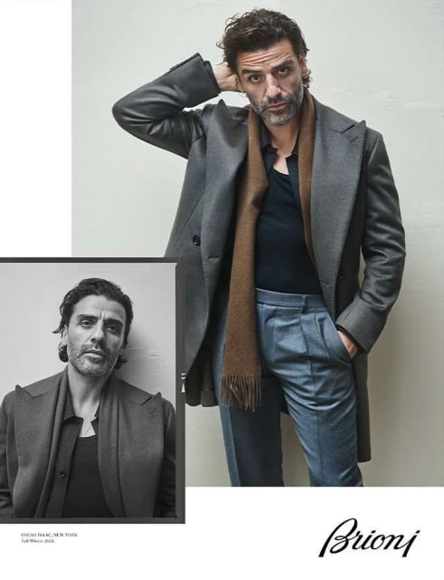 Man poses in grey coat and blue trousers with a sepia-toned close-up insert to the left, logo for Brioni at the bottom.