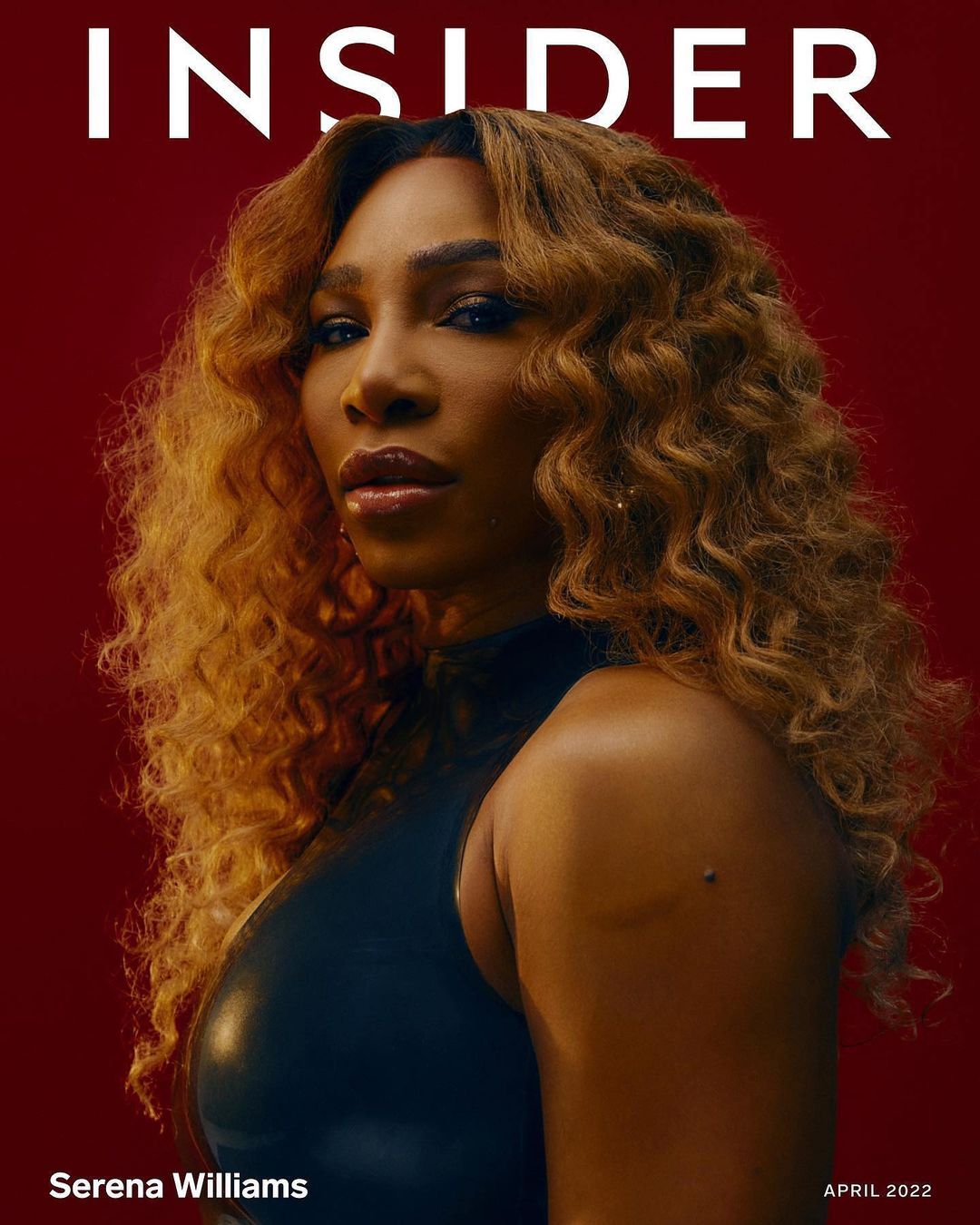 Serena Williams portrait on a magazine cover; she poses wearing a dark, sleeveless top against a red background with curly blond hair.