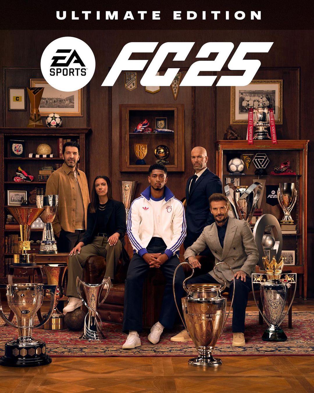 Promotional image for EA Sports FC 25 Ultimate Edition featuring a group of five people surrounded by sports trophies and memorabilia.