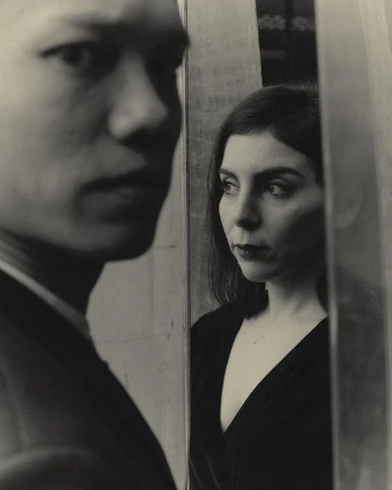 Portrait of an Asian man in the foreground and a woman looking away in a separate pane by photographer Joss Mckinley