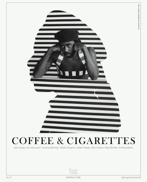Monochrome image of a black model with short dreadlocks wearing a striped top, set against a horizontal striped background in a studio setting.