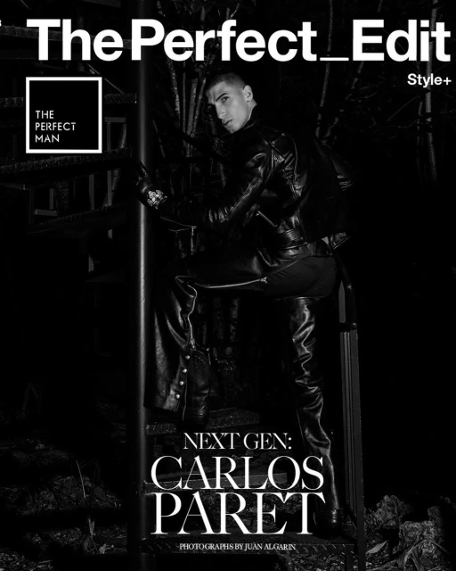 Magazine cover featuring a male fashion model in a black leather outfit, climbing a metal staircase outdoors at night, for 'The Perfect Edit'.