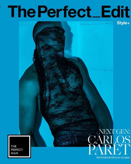 Magazine cover featuring a male model with a black lace veil, wearing a matching top, set against a vivid blue background.