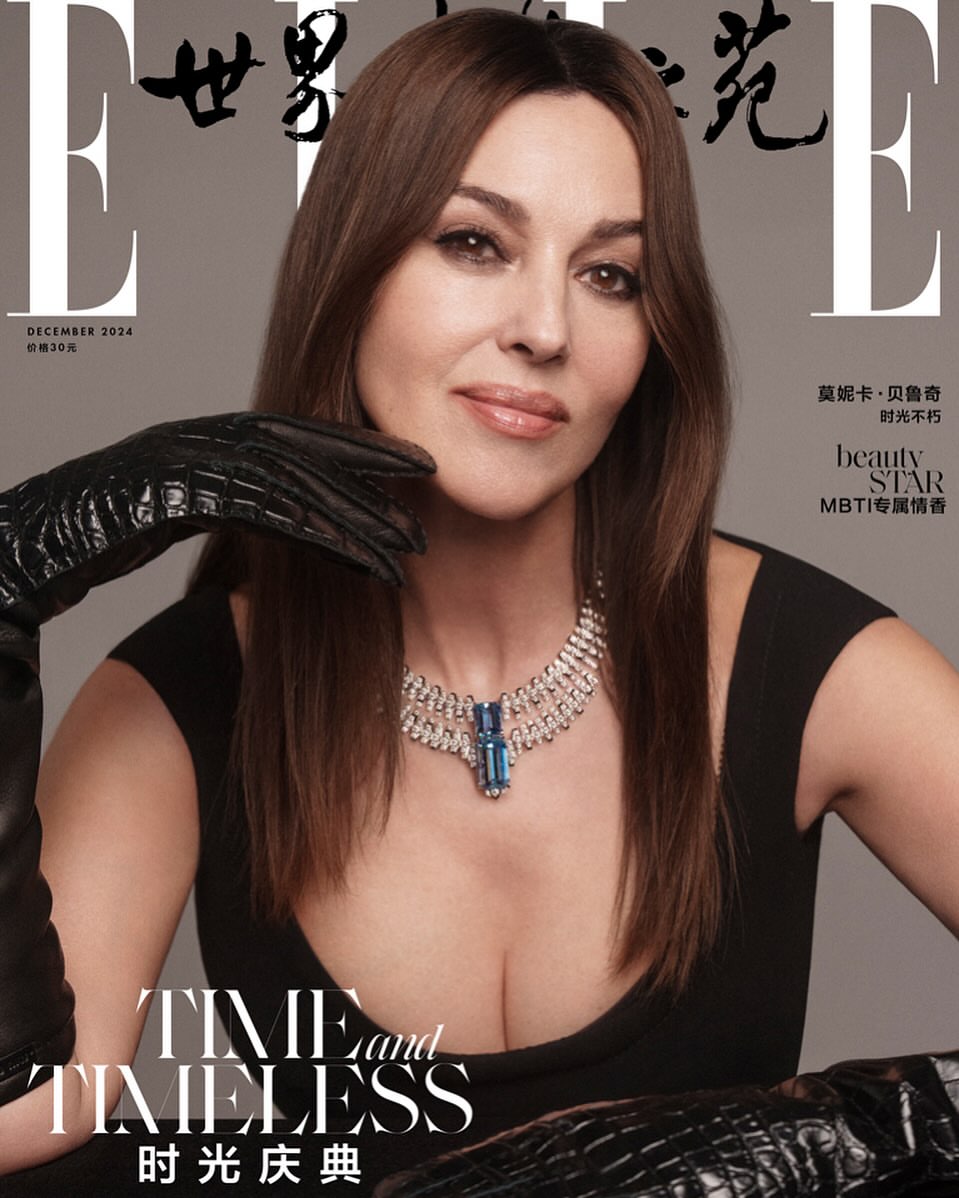 Monica Bellucci on the cover of Elle China December 2024 wearing a black dress and diamond jewelry, shot in a photo studio.