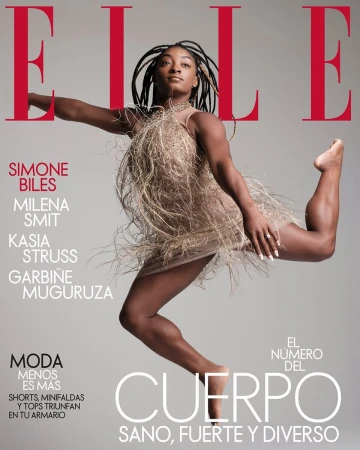 Elle Magazine cover featuring Simone Biles in mid-air wearing a fringed dress against a grey background with red magazine text.