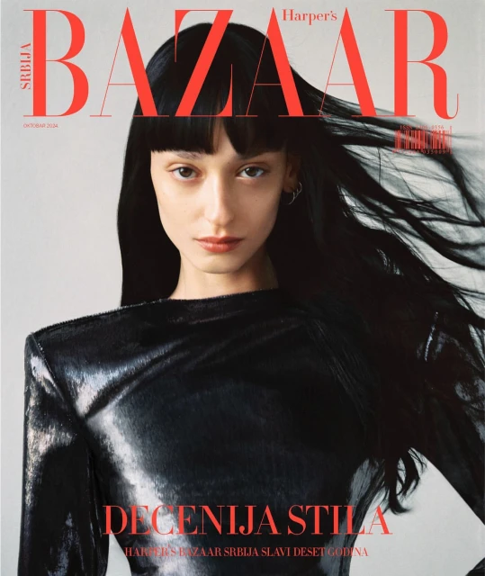 Harper's Bazaar Serbia cover featuring a model with dark hair and bangs wearing a shiny black top. The magazine's title is displayed in bold red letters.