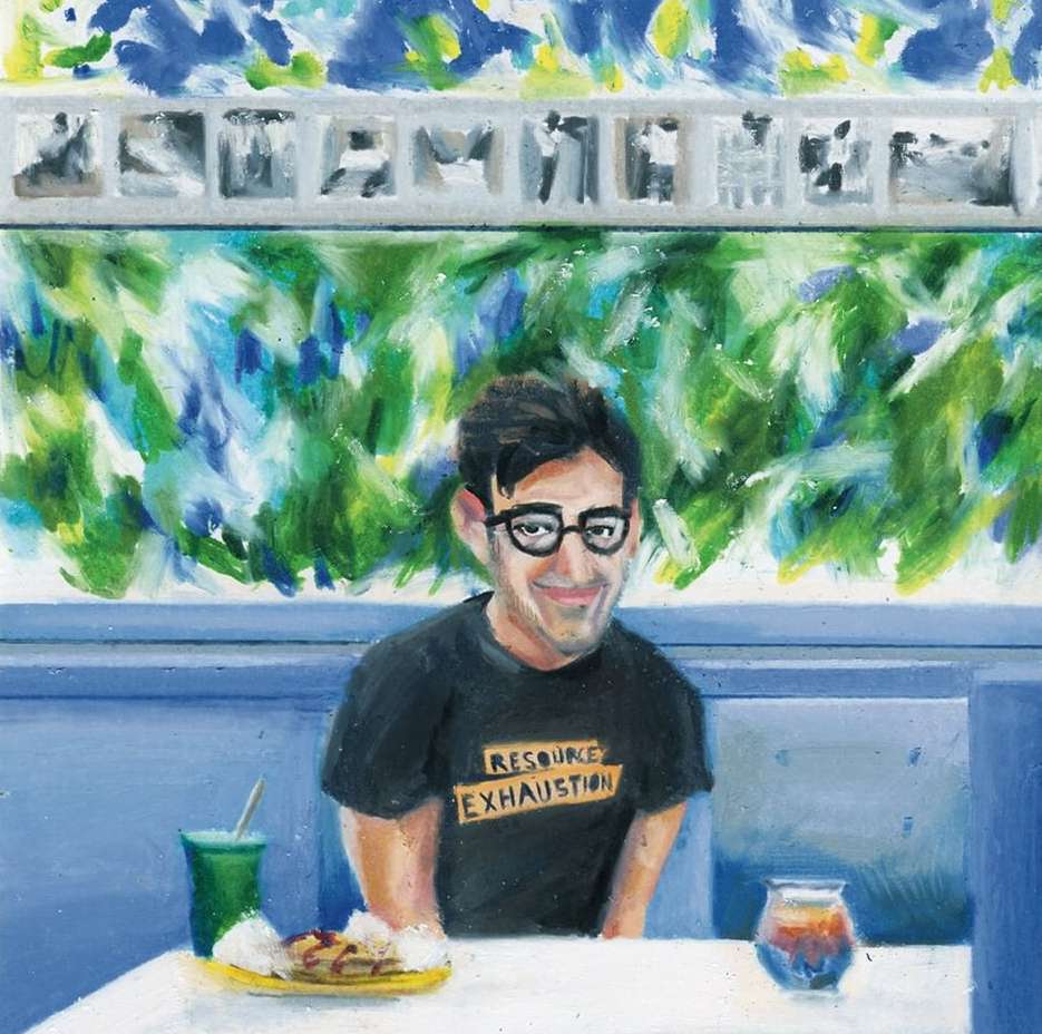 Oil painting of a man with glasses sitting at a table with food and a drink, in front of a painted wall with various images.