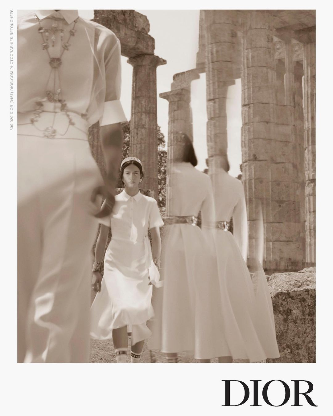 Fashion editorial featuring models in white dresses at ancient ruins, showcasing a blend of modern fashion with historical architecture in sepia.