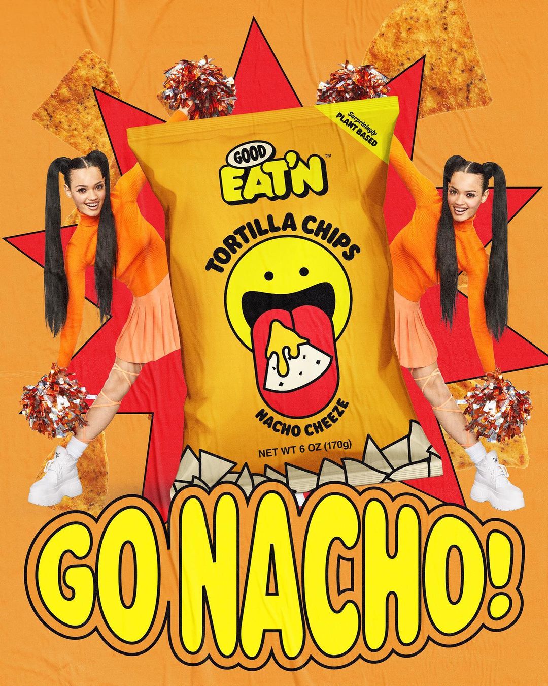 A bag of Good Eat'n Tortilla Chips in Nacho Cheeze flavor is featured with cheerleaders in a vibrant, orange-toned, animated studio setting.