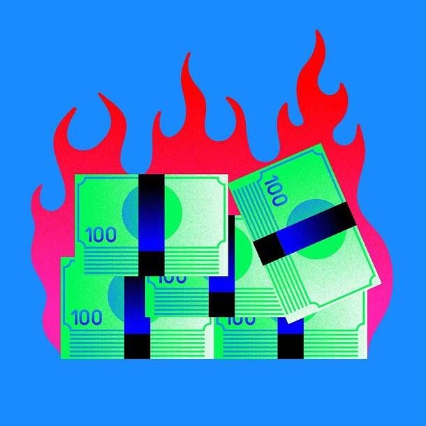 Digital illustration of stacked, banded hundred-dollar bills surrounded by red flame graphics against a bright blue background.