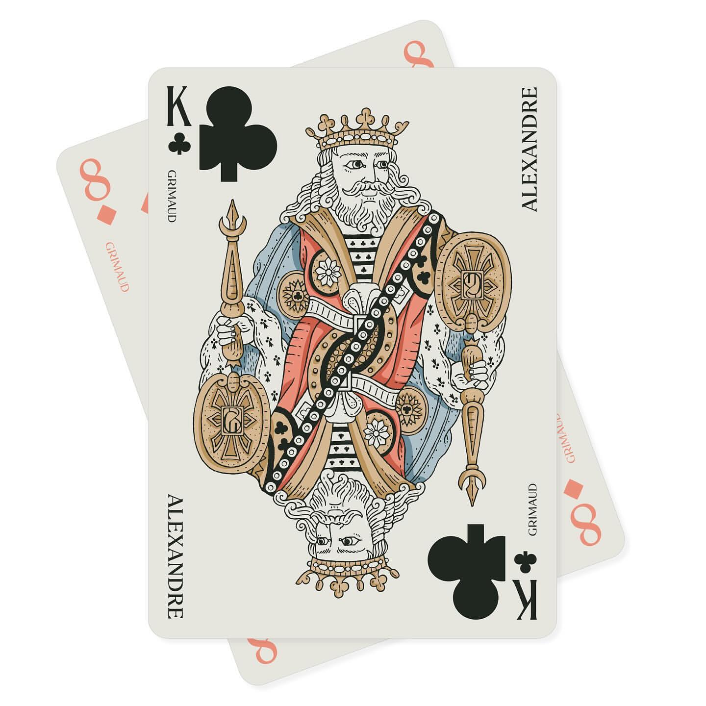 King of Clubs playing card featuring vintage-style illustration of regal figure with sceptre and shield, backed by another card.