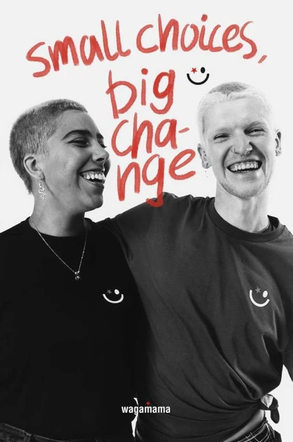 Two smiling adults, one fair-skinned and one darker-skinned, pose with arms around each other, wearing branded t-shirts with 'small choices, big change' text.
