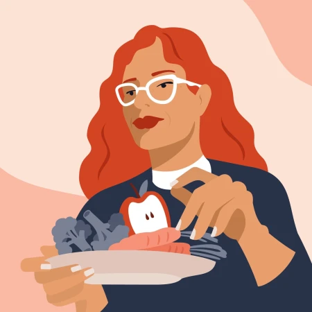Illustration of a red-haired woman in glasses holding a plate with an apple, carrots, and broccoli against a peach-colored background.