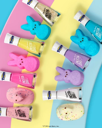 Colorful assortment of Peeps marshmallow candies and matching Sally Hansen Insta-Dri nail polish bottles on a pastel background.