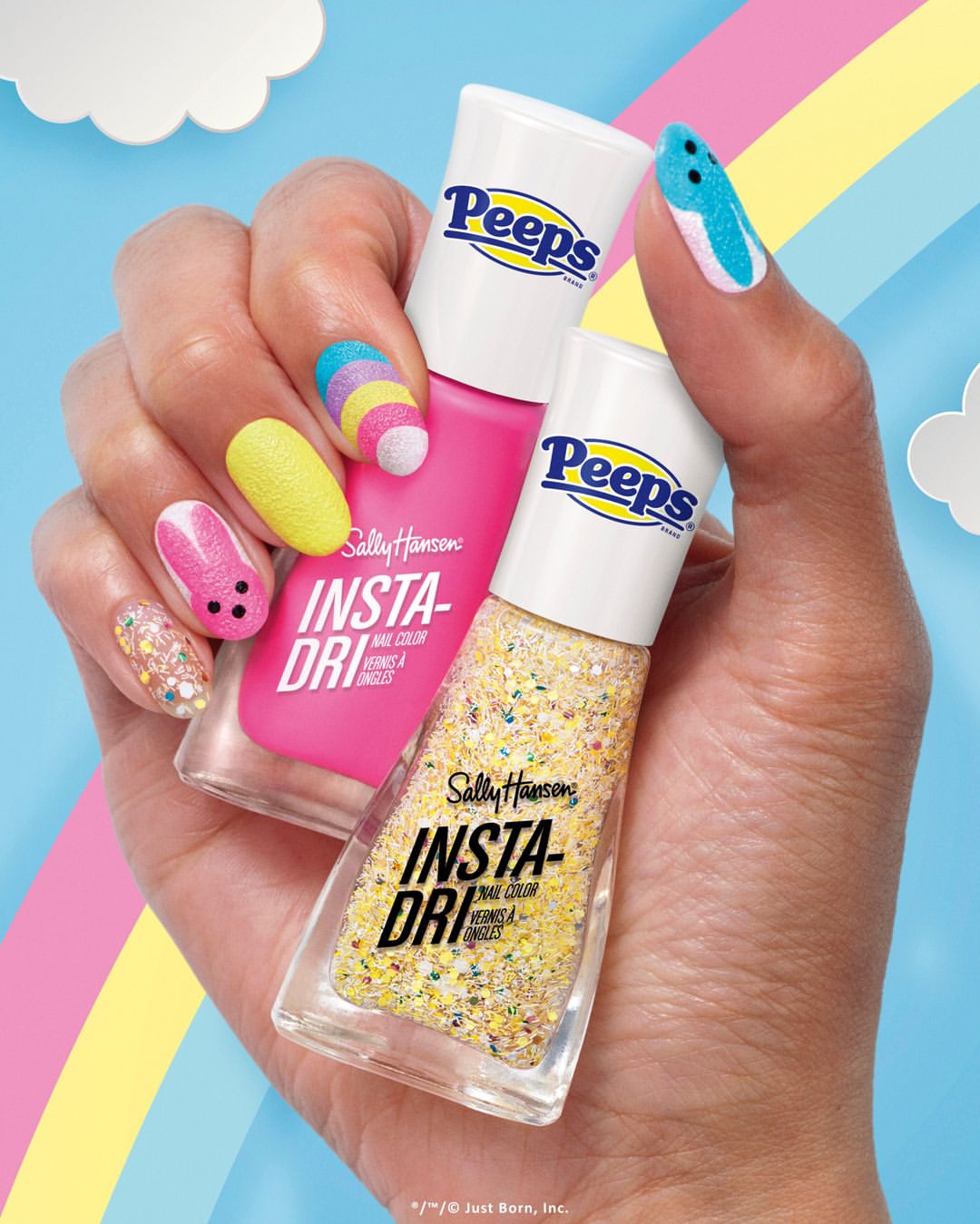 Close-up shot of a woman's hand holding two bottles of Peeps nail polish from Sally Hansen, displayed against a blue background.