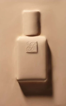 Beige background featuring a molded, lotion-like texture with a central raised impression of a cosmetic bottle and logo.