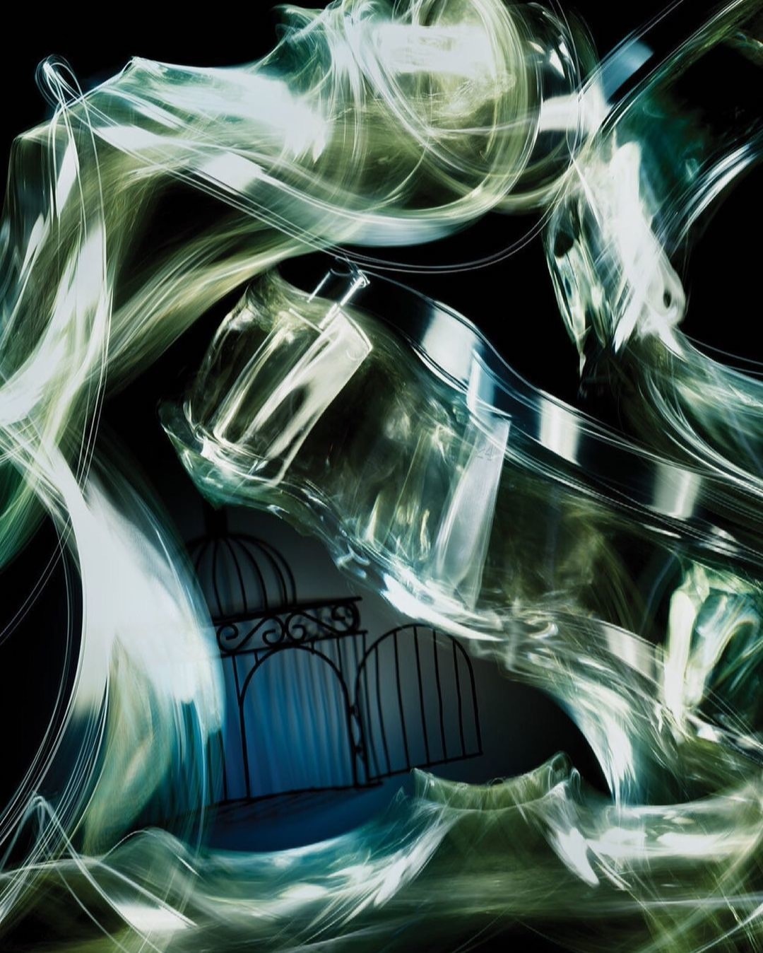 Abstract still life with perfume bottle and wrought-iron gate set against a dark background with swirling, blurred lighting effects.